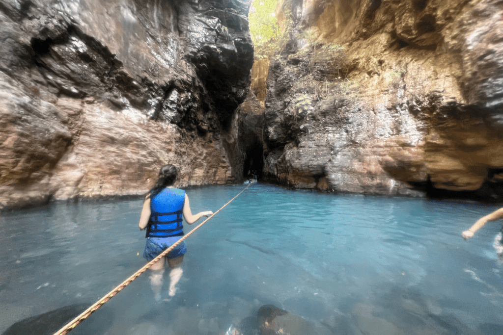 girl hiking to La Leona waterfall. 