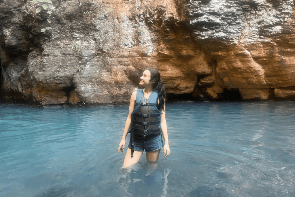 girl in water at La Leona Falls. 